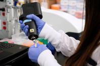 FILE PHOTO: A scientist at RNA medicines company Arcturus Therapeutics research a vaccine for the novel coronavirus (COVID-19) at a laboratory in San Diego