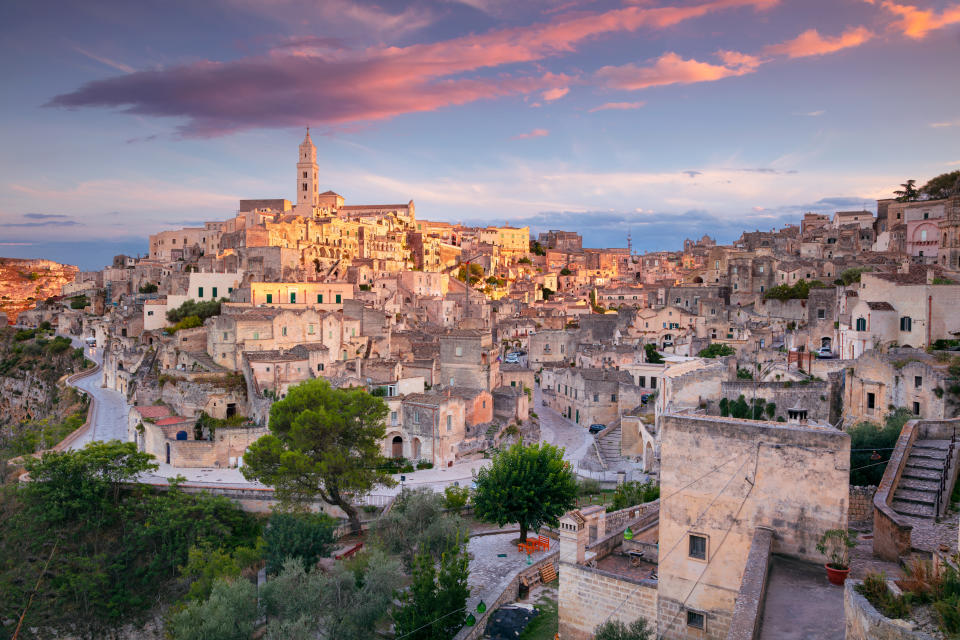 Cityscape aerial image of medieval city of Matera, Basilicata Italy at beautiful summer sunset.