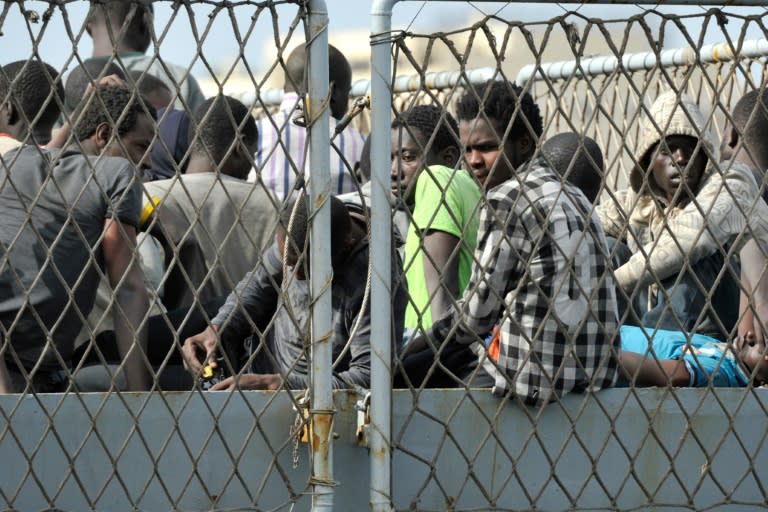 The Italian Navy warship "Vega" arrives with more than 600 migrants and refugees in the Italian port of Reggio Calabria, on May 29, 2016