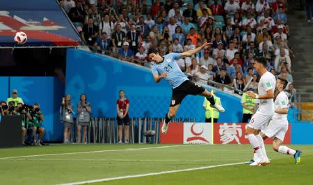 Soccer Football - World Cup - Round of 16 - Uruguay vs Portugal - Fisht Stadium, Sochi, Russia - June 30, 2018 Uruguay's Edinson Cavani scores their first goal. REUTERS/Toru Hanai