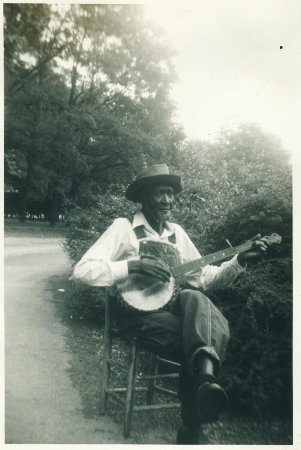 This photo of an unnamed banjo player was taken on a group trip to a Baptist retreat in the Carolinas in 1949.