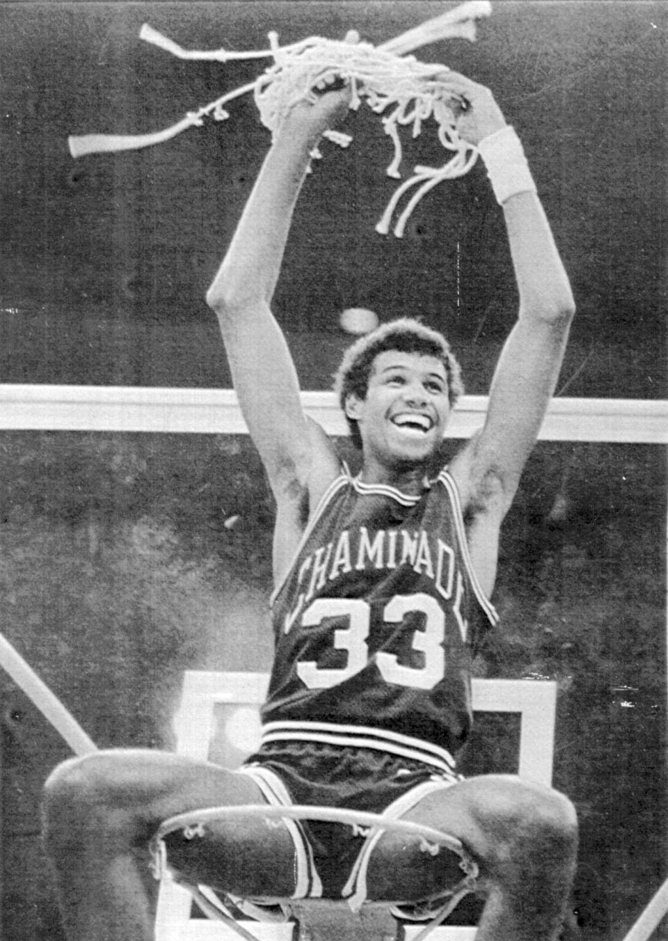 FILE - Chaminade's Richard Haenisch sits atop the basket celebrating the team's 77-72 win over No. 1 Virginia in an NCAA college basketball game in Honolulu, Dec. 23, 1982. (Honolulu Star-Advertiser via AP)