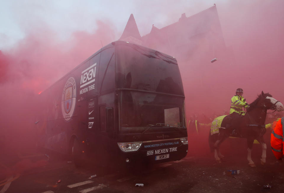 <p>Soccer Football – Champions League Quarter Final First Leg – Liverpool vs Manchester City – Anfield, Liverpool, Britain – April 4, 2018 Liverpool fans set off flares and throw missiles at the Manchester City team bus outside the stadium before the match Action Images via Reuters/Carl Recine </p>