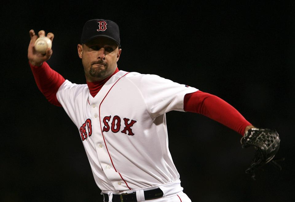 BOSTON - OCTOBER 16:  Pitcher Tim Wakefield #49 of the Boston Red Sox throws a pitch against the New York Yankees after entering the game in the fourth inning during game three of the American League Championship Series on October 16, 2004 at Fenway Park in Boston, Massachusetts.  (Photo by Doug Pensinger/Getty Images)