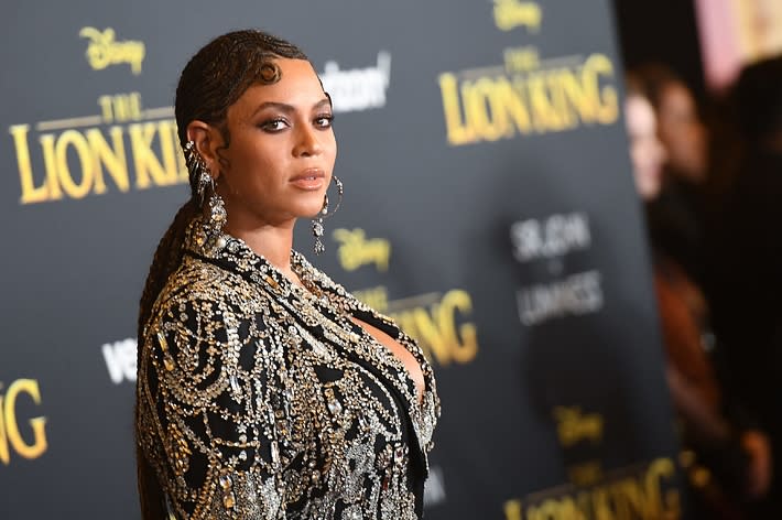 Beyoncé at The Lion King premiere in an embellished gown with braided hair