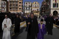 Residents watch the procession of the relics of Saint Spyridon, patron saint of Corfu, during Easter celebrations on the Ionian Sea island of Corfu, northwestern Greece, on Saturday, April 23, 2022. For the first time in three years, Greeks were able to celebrate Easter without the restrictions made necessary by the coronavirus pandemic. (AP Photo/Thanassis Stavrakis)