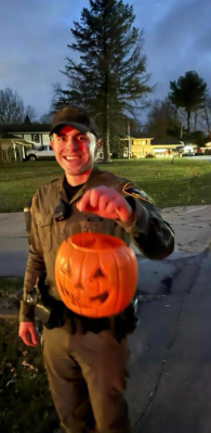 Conservation officer Alex Toth holds the plastic pumpkin that became stuck to a deer's face for about two weeks just outside LaPorte. He and farm animal veterinarian Dr. Larry Smith removed it Friday, Nov. 24, 2023, from the doe's head.