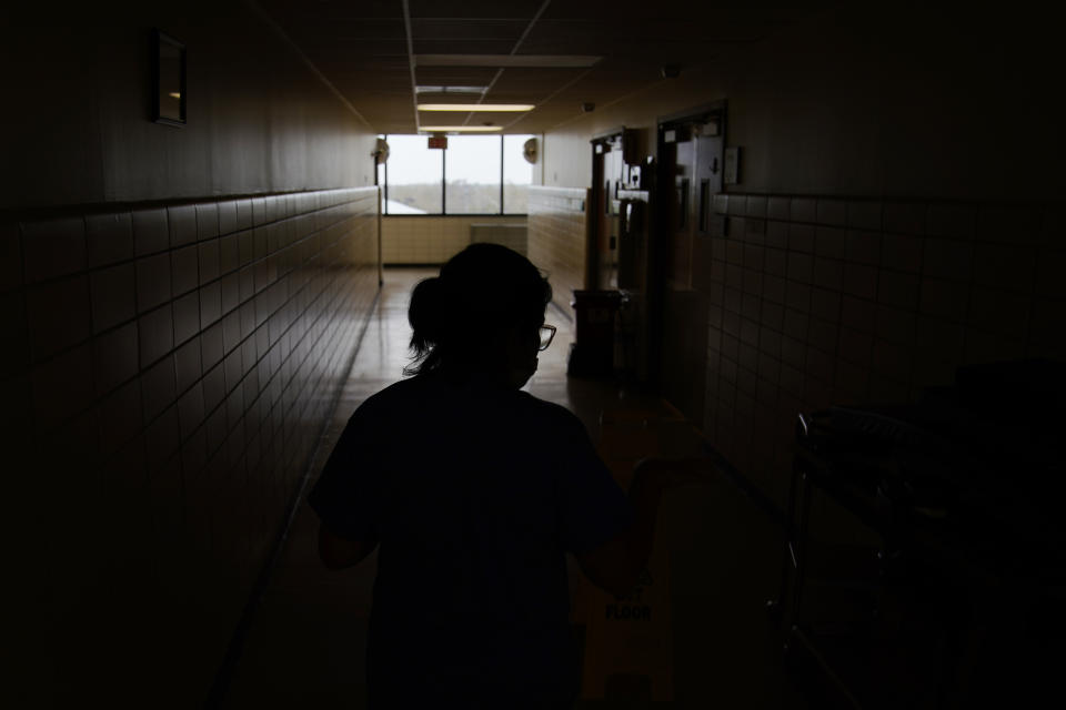 Jana Semere, Chief nursing officer at Leonard J. Chabert Medical Center, walks down a hallway at the hospital in the recently reopened emergency room in the aftermath of Hurricane Ida, Friday, Sept. 3, 2021, in Houma, La. The hospital evacuated patients and had to close due to the hurricane. (AP Photo/John Locher)