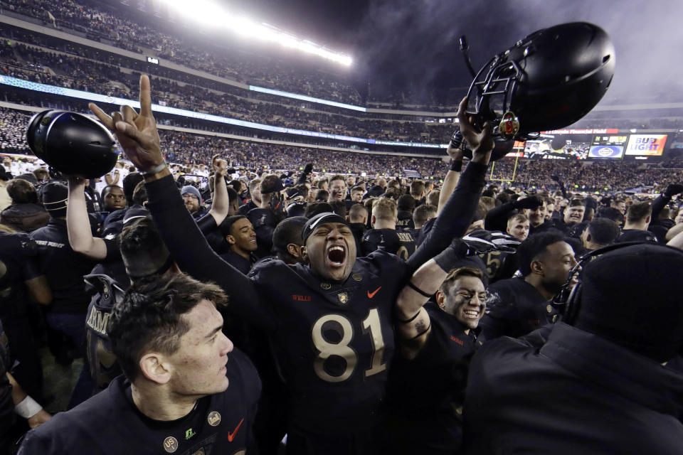 FILE - In this Dec. 8, 2018, file photo, Army's Ke'Shaun Wells celebrates after an NCAA college football game against Navy in Philadelphia. The 120th Army-Navy game is set for Saturday in Philadelphia. Army is trying to win its fourth straight game in the series. (AP Photo/Matt Slocum, FIle)
