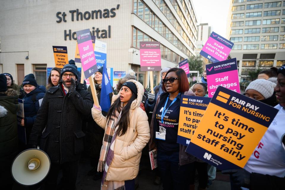 Nurses and supporters gather to demonstrate outside St Thomas’ hospital in Westminster (Getty Images)