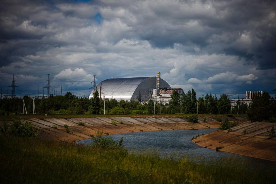 A photograph shows the New Safe Confinement at Chornobyl Nuclear Power Plant which cover the number 4 reactor unit in Ukraine on May 29, 2022, amid the Russian invasion of Ukraine. (Dimitar Diloff/AFP via Getty Images)