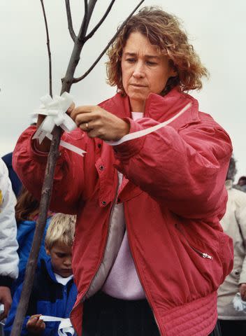 <p>Stearns History Museum/Courtesy Minnesota Historical Society </p> Patty on the first anniversary of Jacob's disappearance at a tree planted in his honor