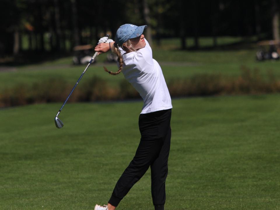 Olentangy Liberty's Olivia Aronhalt watches her approach shot on No. 18 during the Division I district tournament Monday at the Links at Echo Springs.