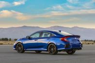 <p>At the rear of the 2020 Civic Si sedan, we see a redesigned bumper with what looks like little body-colored whiskers. The new rear bumper design is only for the sedan; the coupe stays the same. The changes are small and you need a keen eye to spot them, but we think they're tasteful.</p>
