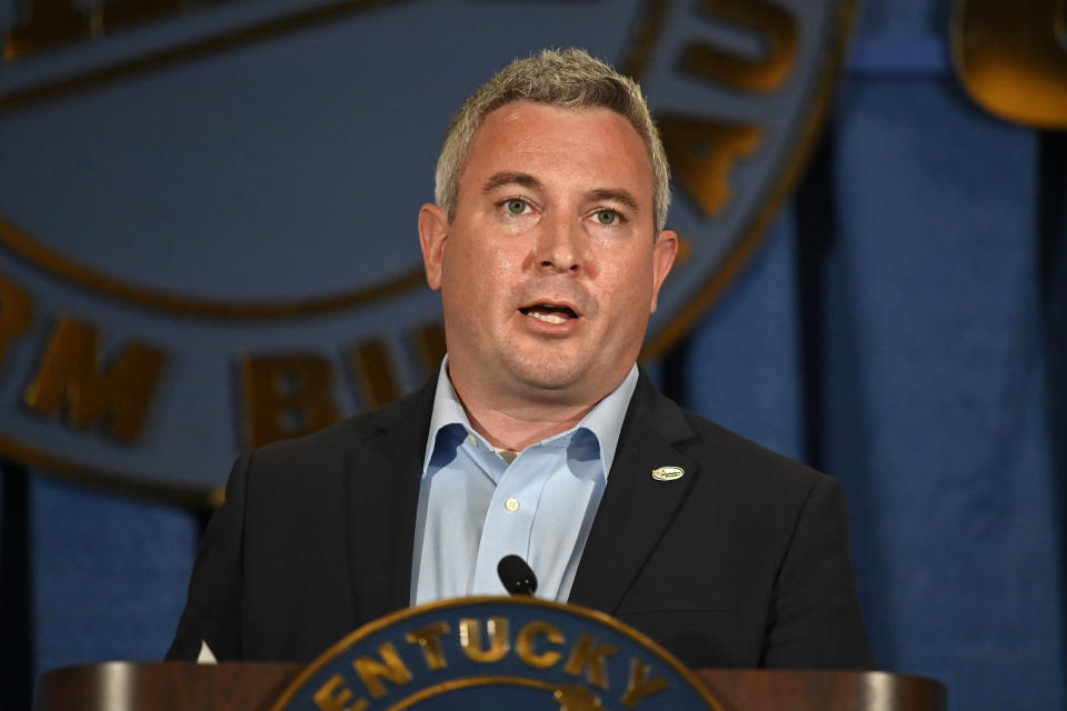 FILE - Kentucky Agricultural Commissioner Ryan Quarles addresses the audience at the Kentucky Farm Bureau Ham Breakfast at the Kentucky State Fair in Louisville, Ky., Thursday, Aug. 26, 2021. On Friday, June 17, 2022, Kentucky gubernatorial hopeful Quarles doubled down on his grassroots Republican strategy, and Kelly Craft hinted anew at her own continuing interest in Kentucky's top political job, undeterred after Donald Trump shook up the 2023 campaign by endorsing Attorney General Daniel Cameron. (AP Photo/Timothy D. Easley, File)