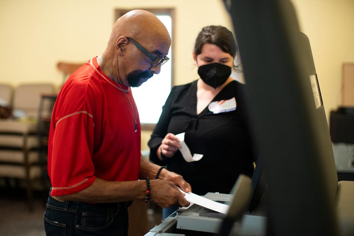 Aug 8, 2023; Columbus, Ohio, USA;   George Marshall, of the northeast side casts his ballot in the special election on Issue 1, at House of Faith Ministries, which was a polling location for three different precincts during this election.