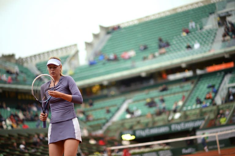 Russia's Maria Sharapova, seen during her 2nd round match against Canada's Eugenie Bouchard, during the French Open tennis tournament, at the Roland Garros stadium in Paris, on May 30, 2013. Sharapova, the women's title holder, was 6-4, 4-2 up against Canadian teenager when rain brought a halt to their clash, which means she too has to return for a second successive day, on Friday