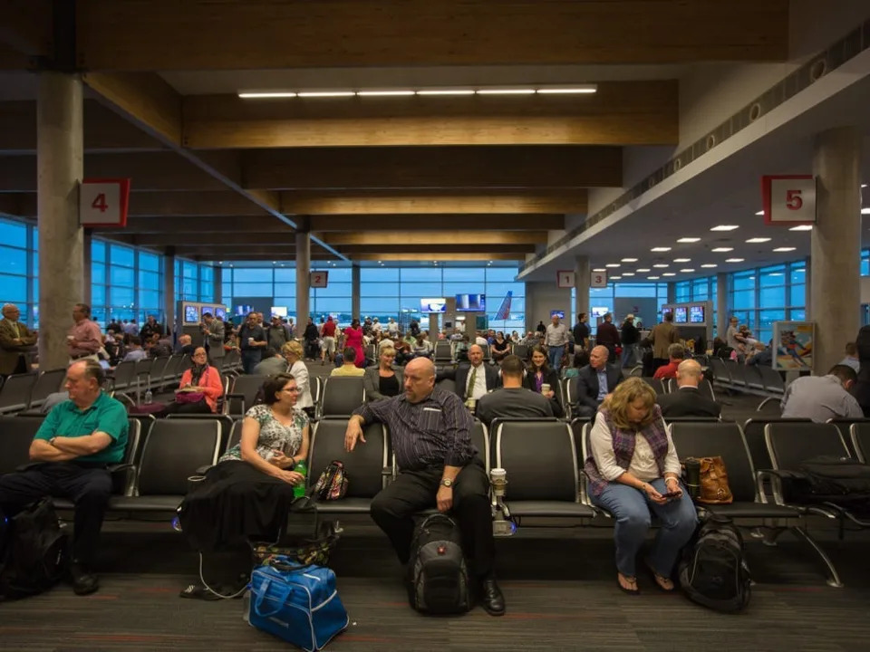Passengers sit in new Love Field terminal