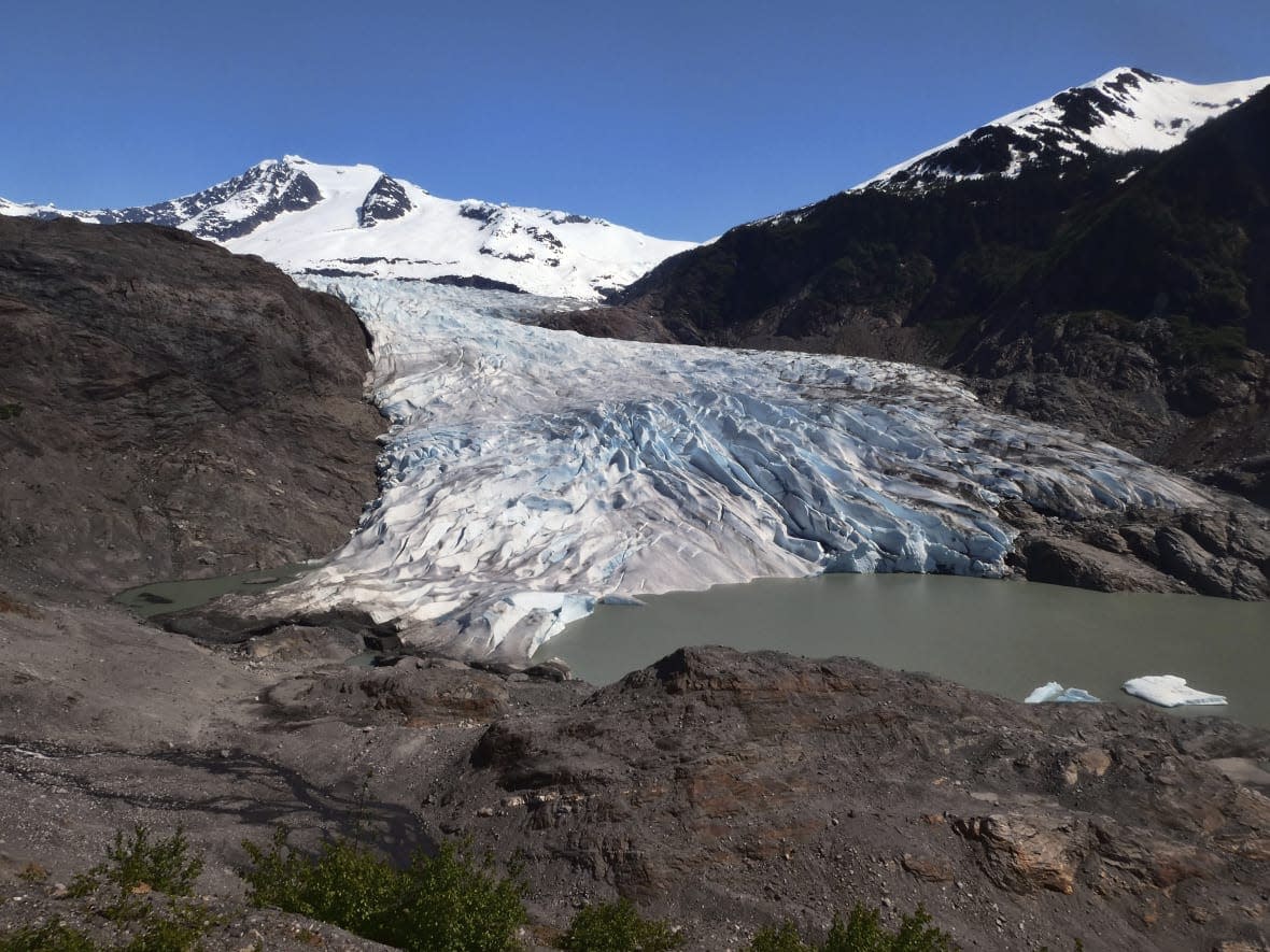 Chunks of ice float on Mendenhall Lake in front of the Mendenhall Glacier on Monday, May 30, 2022, in Juneau, Alaska. (AP Photo/Becky Bohrer)