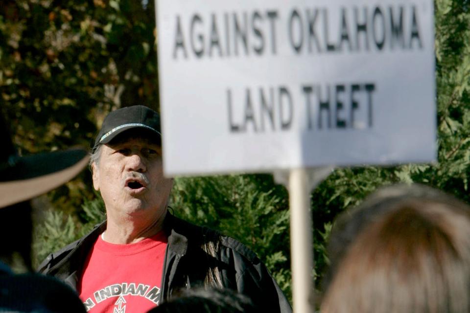 FILE - Dwain Camp of Ponca City, Okla. speaks Friday, Nov. 16, 2007 in Oklahoma City, during the Oklahoma Indians Survival Walk and Remembrance Ceremony near the state Capitol. Camp, a member of the Ponca Tribe of Oklahoma, was in California when his younger brother, Carter, called to say he and other leaders of the American Indian Movement took a group of activists into Wounded Knee in 1973. “He was telling me they were in a hell of a fight,” Camp, now 85, recalled. “I heard the gunfire and that was all I needed. I went up there and stayed for the duration of the standoff.” (Jaconna Aguirre/The Oklahoman via AP, File)