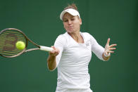 Russia's Veronika Kudermetova returns to Estonia's Kaia Kanepi during their first round women's singles match on day one of the Wimbledon tennis championships in London, Monday, July 3, 2023. (AP Photo/Kin Cheung)