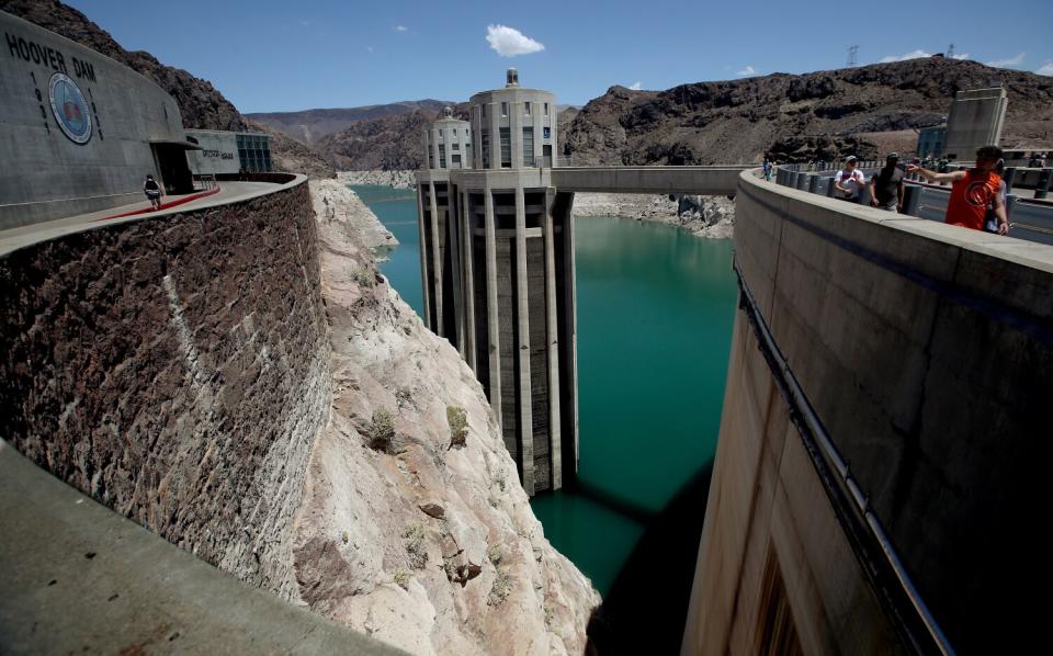 Low water levels at Hoover Dam expose rocky sides