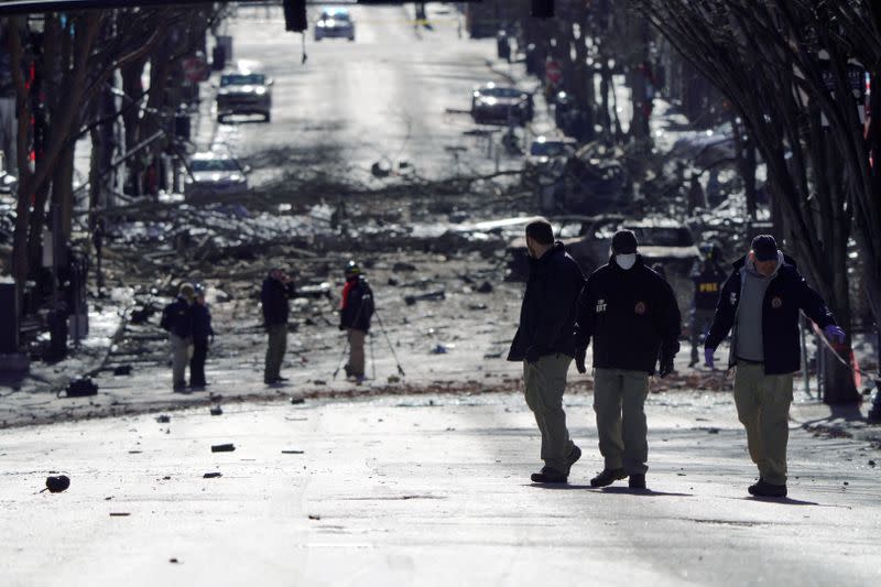 FILE PHOTO: Investigators work near the site of an explosion on 2nd Avenue that occurred the day before in Nashville