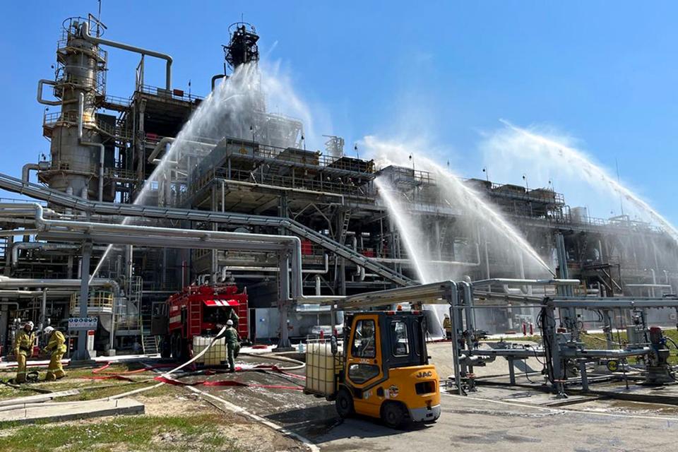 Emergency services put out a fire at the Novoshakhtinsk refinery (Russian Emergency Ministry Press Service via AP)