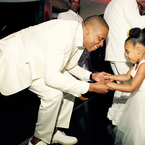 It's safe to say Beyonce and Jay Z's adorable three-year-old daughter Blue Ivy had quite the good time at her grandmother Tina Knowles' wedding last week to actor Richard Lawson. Beyonce shared a few super-cute pictures of Blue Ivy celebrating the happy occasion on her website, in which her daughter sports a poofy white tulle dress, a tiara and wore her hair in adorable buns. Check her out all smiles with her dad Jay Z, her cousin Daniel Julez, her aunt Solange and her uncle Alan Ferguson. Beyonce PHOTOS: Blue Ivy's Most Adorable Moments Blue also hit the dance floor during the night, keeping close to Jay. Have you ever seen the "Holy Grail" rapper look this happy?! Beyonce But perhaps the fiercest dance of the night belonged to Blue and Solange, who judging by this pic, had all of their fellow wedding guests in a spell. Beyonce Tina and Richard -- who’ve known each other for 33 years before their relationship turned romantic a year and a half ago, following her 2011 divorce from Matthew Knowles -- wed aboard a yacht in Newport Beach, Calif., on April 12. According to the bride herself, it was Blue Ivy who convinced them to tie the knot! "[In September] we went on a boat with Beyoncé and Jay Z for her birthday, and when we came out one night dressed to go to dinner, Blue said, 'Oh, ya'll look beautiful. When are ya'll getting married?'" Tina recently told <em>People</em>. "Richard said, 'Oh, Blue, soon. Do you approve?' And she said yes. That's the first time we talked seriously about getting married." Beyonce Beyonce VIDEO: Tina Knowles Spills Solange Wedding Details Check out the video below to see Beyonce, Solange and Kelly Rowland's amazing all-white outfits at Tina's wedding.