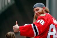 Jun 18, 2015; Chicago, IL, USA; Chicago Blackhawks right wing Patrick Kane (88) gives a thumbs up to the crowd during the 2015 Stanley Cup championship parade and rally at Soldier Field. Mandatory Credit: Jon Durr-USA TODAY Sports -