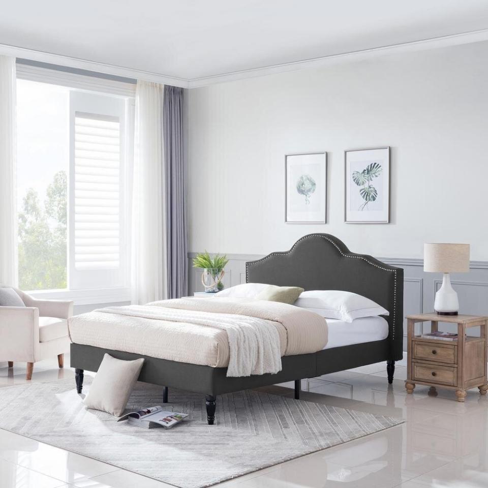 Lie back and relax in this bed frame, which features an upholstered headboard with a nail trim that feels special. It comes with wood slats so you won't need a box spring. Right now, it's super affordable, too. <a href="https://fave.co/3dfUODC" target="_blank" rel="noopener noreferrer">Originally $414, get it now for $343 at The Home Depot</a>.