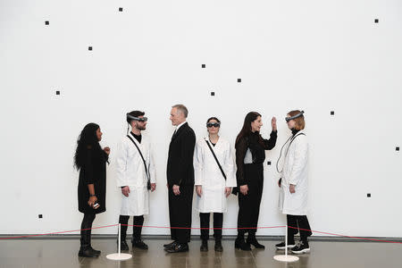 Artist Marina Abramovic and actor Todd Eckert pose for a photograph ahead of 'The Life' exhibition, the world's first large-scale performance exhibited using Mixed Reality at the Serpentine Gallery in London, Britain February 18, 2019. REUTERS/Simon Dawson