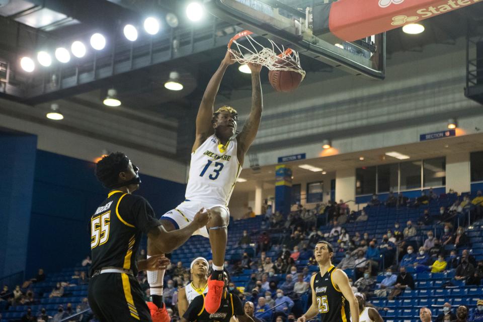 University of Delaware's Jy‡re Davis (13) dunks in the first half of their game against Towson Monday, Jan. 24, 2022, at The Bob Carpenter Center. 