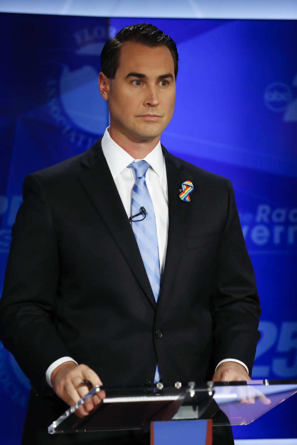 Democratic gubernatorial candidate Chris King awaits the start of a debate ahead of the Democratic primary for governor, Thursday, Aug. 2, 2018, in Palm Beach Gardens, Fla. (AP Photo/Brynn Anderson)