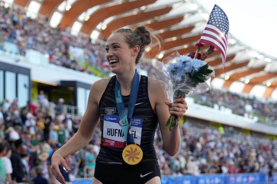 University of Kentucky graduate Charity Hufnagel takes a victory lap with her gold medal after winning the women’s high jump at U.S. Olympic Trials in Eugene, Oregon, on Monday.