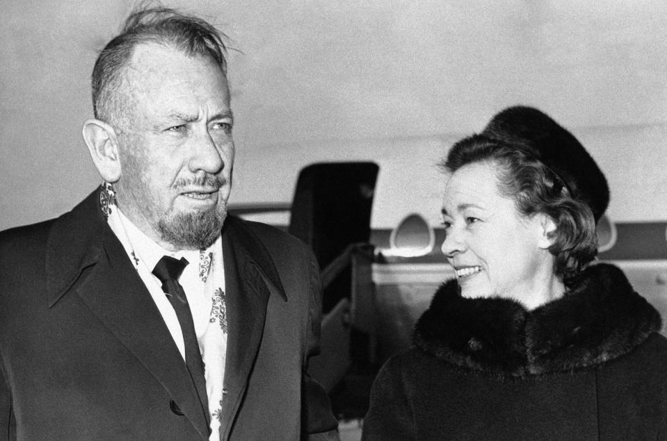 File - In this Dec. 13, 1962, file photo, shows author John Steinbeck, with his wife after their arrival at London Airport. A federal appeals court has thrown out $8 million in punitive damages against the daughter-in-law of Steinbeck in her long-running copyright spat with the late author's step-daughter. The 9th U.S. Circuit Court of Appeals on Monday, Sept. 9, 2019, upheld a $5 million verdict against Gail Steinbeck and told her it's time to end her legal saga. (AP Photo/File)