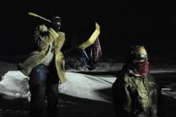 Veterans have a demonstration on Backwater bridge during a protest against plans to pass the Dakota Access pipeline near the Standing Rock Indian Reservation, near Cannon Ball, North Dakota, U.S. December 1, 2016. REUTERS/Stephanie Keith