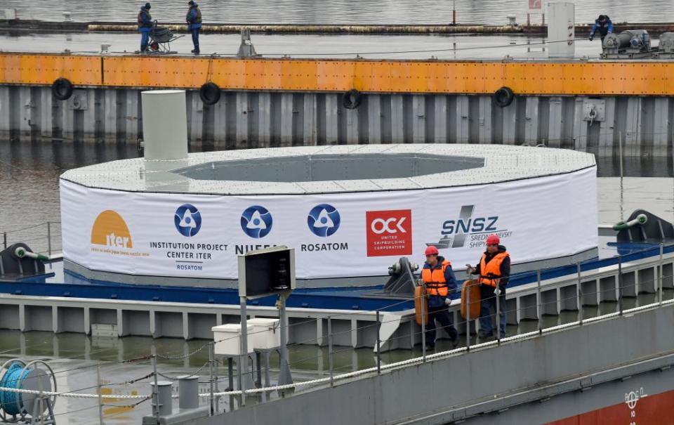 The Russian-made poloidal field coil number 1 (PF1) that will serve to confine plasma in the International Thermonuclear Experimental Reactor (ITER) vacuum vessel, sits on a barge during a ceremony to send the coil to the ITER construction site in southern France, in Saint Petersburg on November 1, 2022. - Thirty-five nations are collaborating in the ITER energy project aimed at mastering energy production from hydrogen fusion, as in the heart of the sun, a potential new source of carbon-free and non-polluting energy.<span class="copyright">AFP/Getty Images</span>