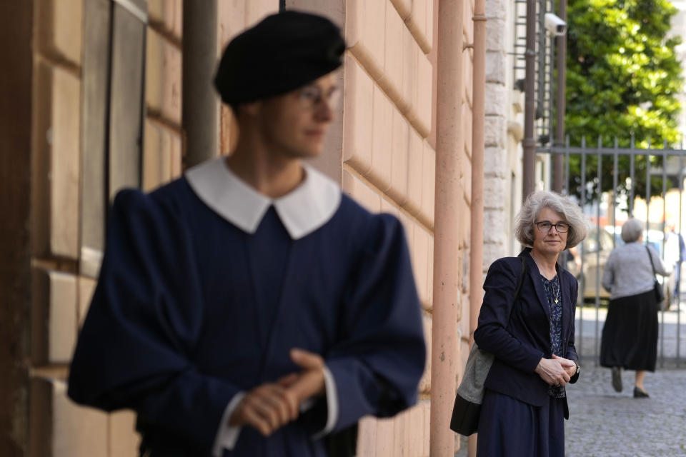 FILE -- Sister Nathalie Becquart, right, poses for a photo as she enters Vatican City, Monday, May 29, 2023. In 2021 Pope Francis appointed Becquart as undersecretary of the Synod of bishops' Organizing Secretariat, a job which by its office entitled her to a vote but which had previously only been held by a man. At previous synods, women were only allowed more marginal roles of observers or experts, literally seated in the last row of the audience hall while the bishops and cardinals took the front rows and voted. In the upcoming synod starting Oct. 4, all participants will be seated together at hierarchically neutral round tables to facilitate discussion. (AP Photo/Alessandra Tarantino, File)