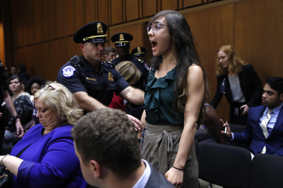 A woman voices her opposition to Supreme Court nominee Brett Kavanaugh during a Senate Judiciary Committee hearing on his nomination in Washington, D.C., on Tuesday. (AP Photo/Jacquelyn Martin)