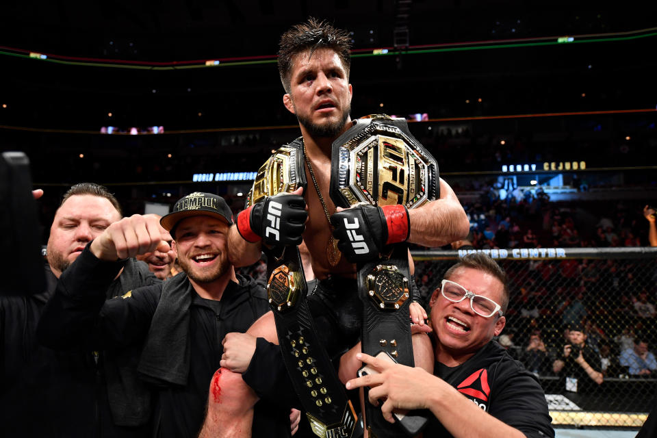 CHICAGO, IL - JUNE 08:  Henry Cejudo celebrates his TKO victory over Marlon Moraes of Brazil in their bantamweight championship bout during the UFC 238 event at the United Center on June 8, 2019 in Chicago, Illinois. (Photo by Jeff Bottari/Zuffa LLC/Zuffa LLC via Getty Images)