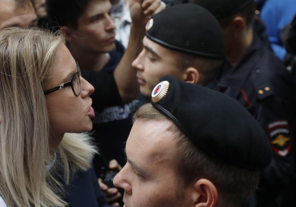 FILE - In this file photo taken on July 14, 2019, Russian opposition candidate and lawyer at the Foundation for Fighting Corruption Lyubov Sobol stands in front of police line during a protest in Moscow, Russia. This summer's wave of opposition protests has pushed Sobol to the forefront of the Russian political scene. (AP Photo/Pavel Golovkin, File)