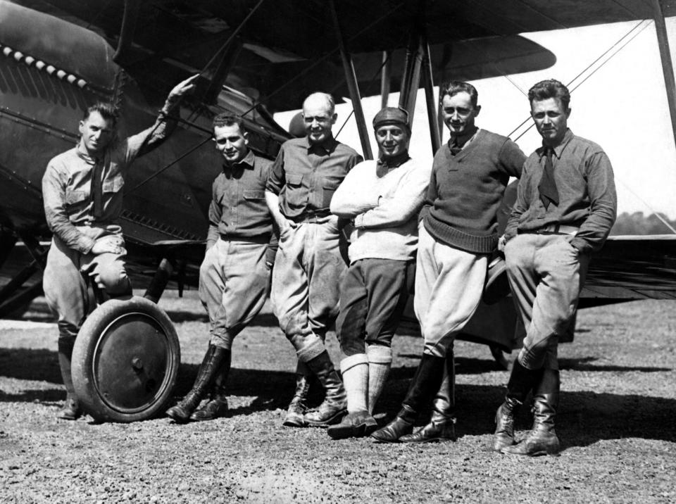 UNITED STATES - CIRCA 1924:  From The Left To The Right, The Guides Henry Ogden And Leigh Wade, The Lieutenants Erick Nelson, John Harding, P. Leslie Arnold And Lowell H. Smith Who Made The First World Tour By Plane Within 175 Days, Posing On Their Plane Douglas World Cruiser At The Boston Airport, At Their Arrival In 1924.  (Photo by Keystone-France/Gamma-Keystone via Getty Images)