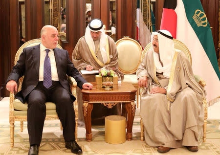 Kuwait's Emir Sheikh Sabah Al Ahmad Al Sabah meets with Iraqi Prime Minister Haider al-Abadi in Kuwait City, Kuwait, February 14, 2018. Iraqi Prime Minister Media Office/via REUTERS