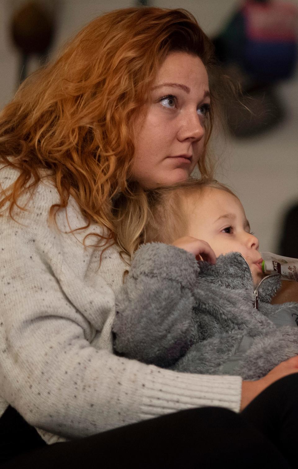 Peyton Martin, 2, and her mom, Natalie, wind down to the Disney movie "Moana" at their Evansville home Wednesday night, Nov. 10, 2021. 