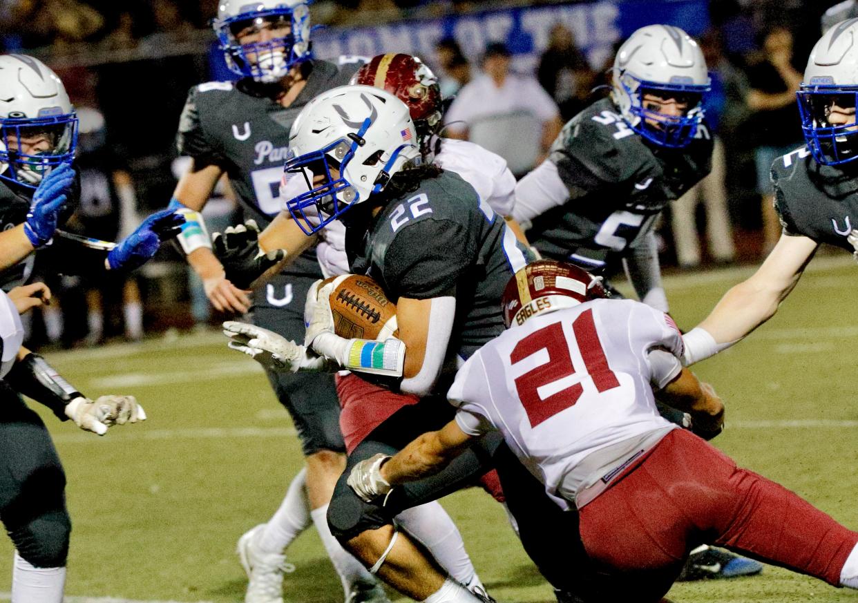 U-Prep's Ryan Dyab (22) carries the ball against West Valley in their game Friday, Oct. 21, 2022.