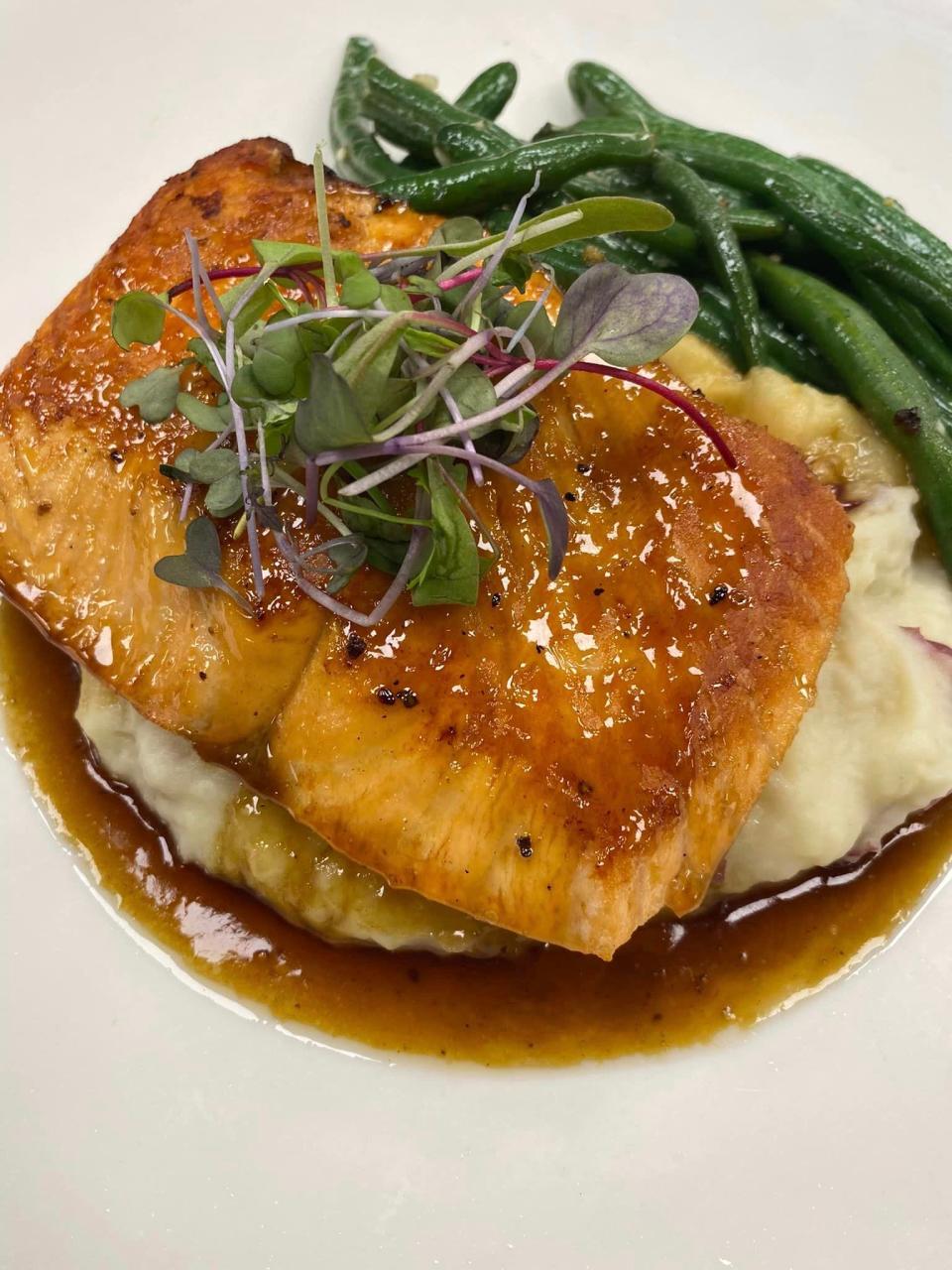 The Bourbon Salmon at The Charred Oak Tavern is back on the menu.