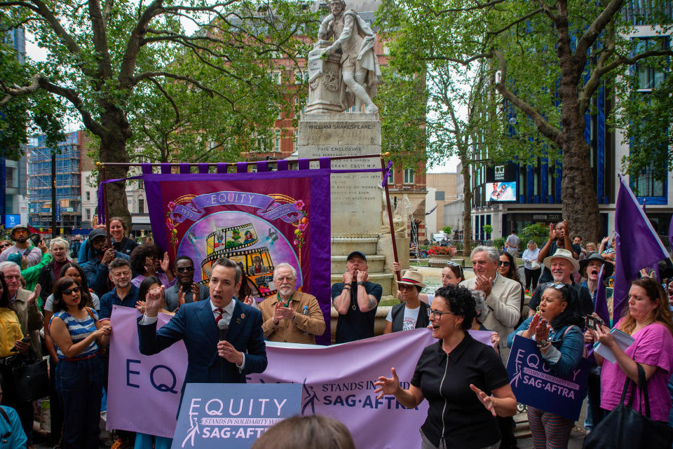 A member of the Equity,                  the British performing arts and entertainment trade union, speaks during a rally in London's Leicester Square to show their solidarity with the SAG-AFTRA and WGA strikes in the U.S. Along with the Labour MP John McDonnell, many famous British actresses and actors attended the demonstration, including Rob Delaney, Andy Serkis, David Oyelowo, Hayley Atwell, Brian Cox, Simon Pegg, Imelda Staunton and Jim Carter. / Credit: Krisztian Elek/SOPA Images/LightRocket via Getty Images