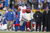 GREEN BAY, WI - JANUARY 15: Hakeem Nicks #88 of the New York Giants runs with the ball after a catch on his way to scoring a 66 yard touchdown against the Green Bay Packers during their NFC Divisional playoff game at Lambeau Field on January 15, 2012 in Green Bay, Wisconsin. (Photo by Jamie Squire/Getty Images)