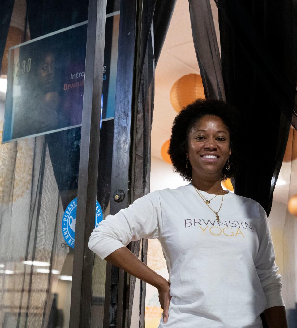 Owner Shawandra Ford stands in front of BRWNSKN Yoga, a studio she created to promote inclusivity in yoga, Monday, May 16, 2022, in Memphis. 